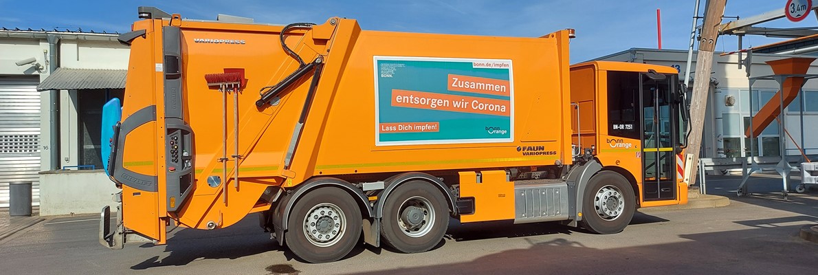 Bonn Orange - Neue Corona motiv montiert auf abfallfahrzeuge mit Flexsign Bannersystem